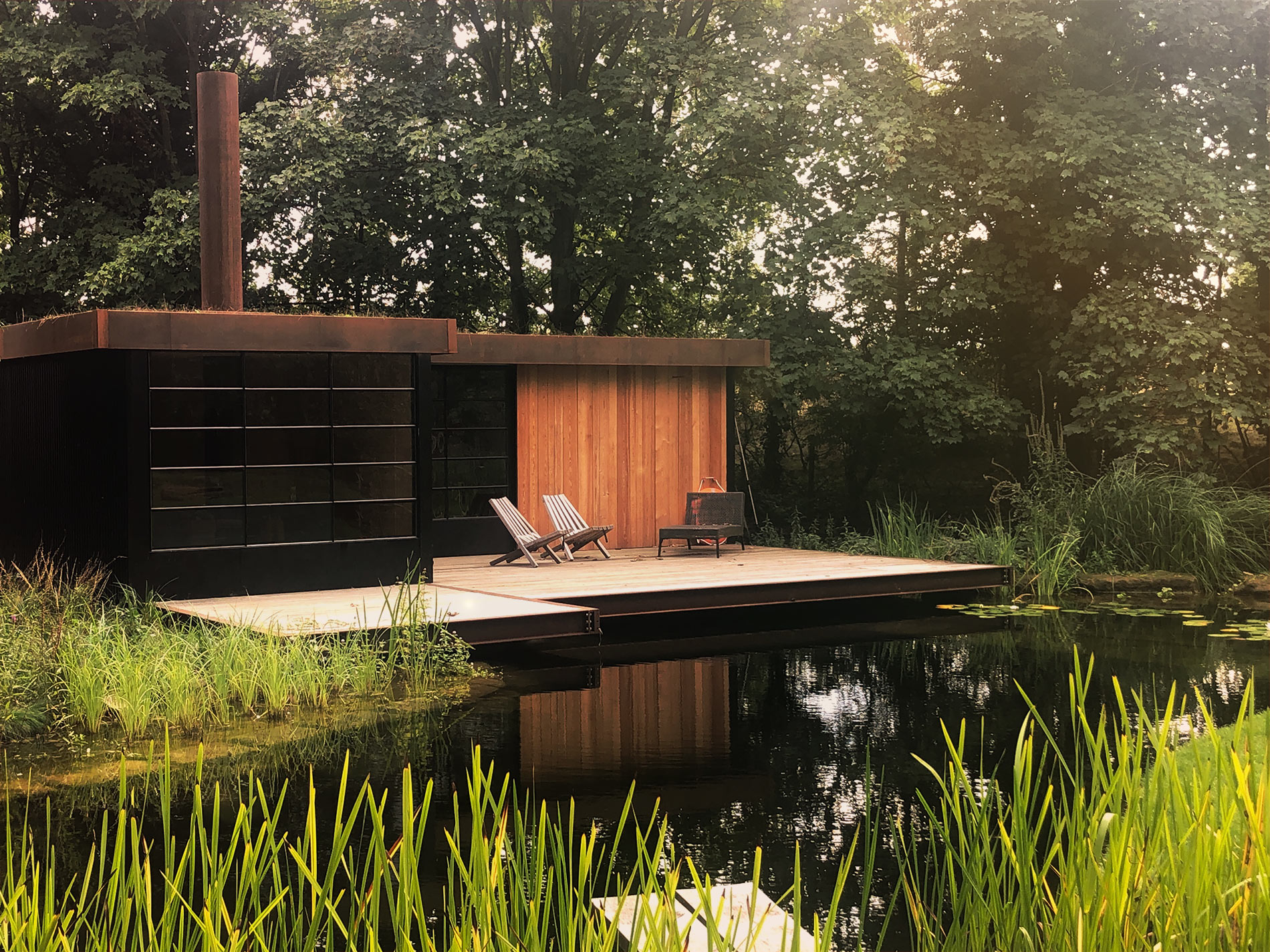 Contemporary pool house by the swimming pond will allow time in the garden to extend well into the night and provide a hub for entertaining